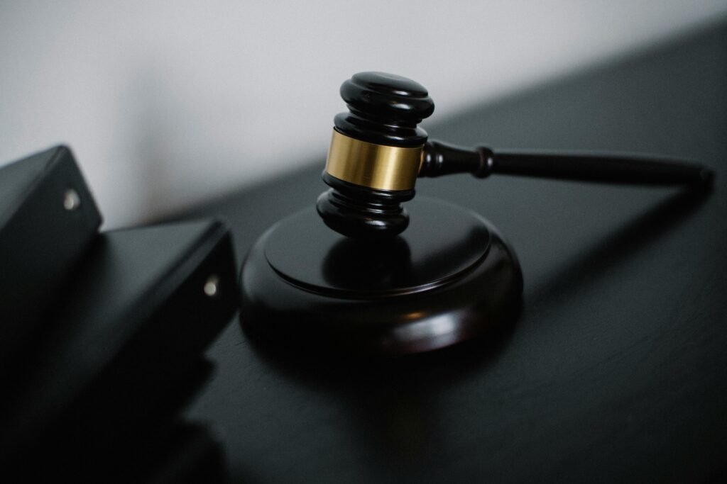 pexels photo 5668473 5668473 Close-up of a wooden gavel on a desk, symbolizing justice and legal authority.
